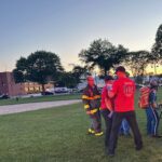 Canton Firefighter/Paramedics treating the 20-year-old patient at the landing zone in Walpole on Friday, July 19. (Courtesy Photo/Canton Fire Department()